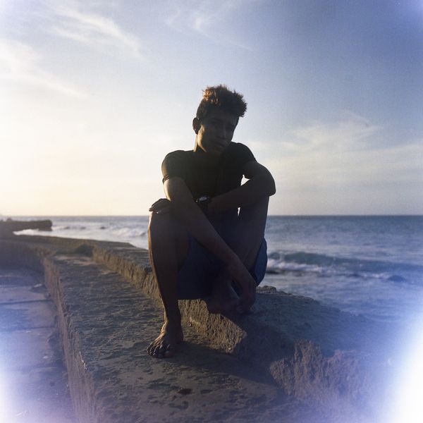 © Andrea Hernández Briceño - A fisherman sits in the pier at Choroní, Venezuela, on January 31, 2021.
