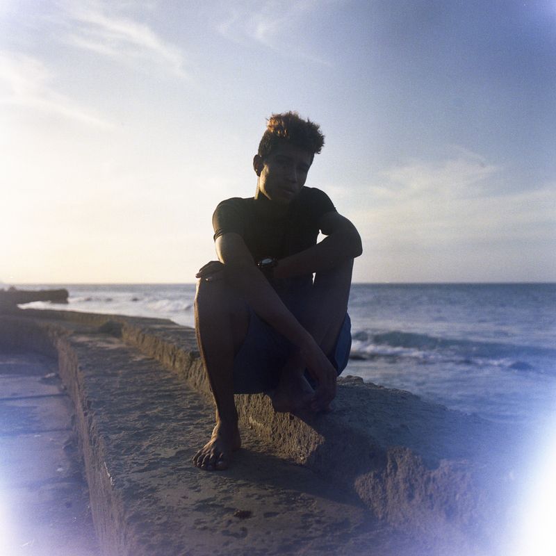 © Andrea Hernández Briceño - A fisherman sits in the pier at Choroní, Venezuela, on January 31, 2021.