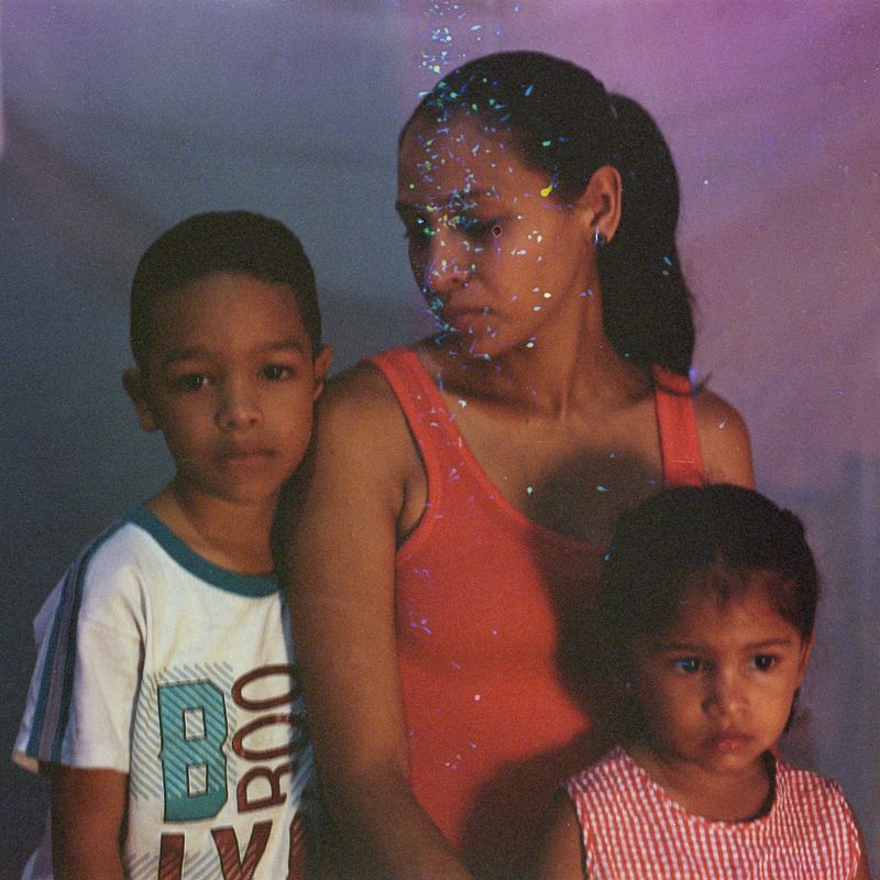 © Andrea Hernández Briceño - The Manjarrés family pose for a portrait in the La Vega barrio of Caracas, Venezuela, on August 30, 2019.