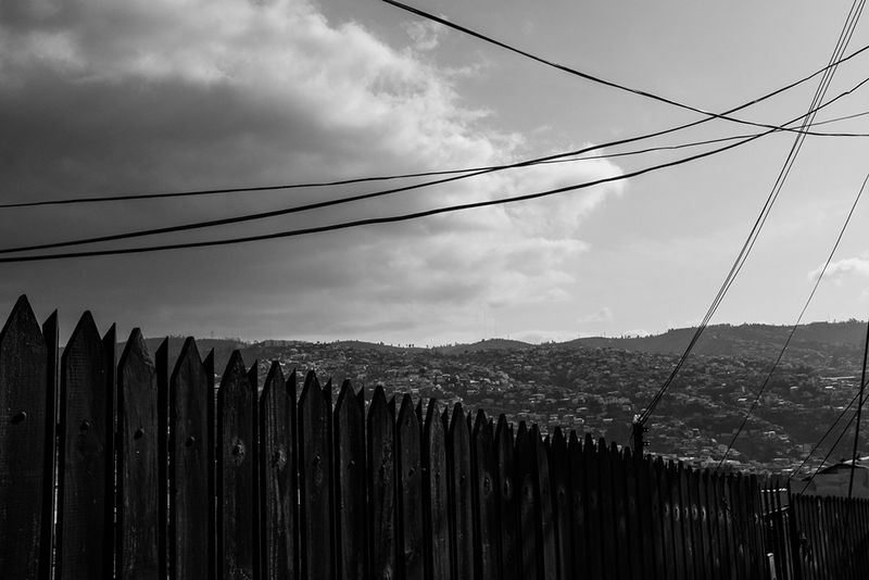 © Éléonore Simon - Cerro Larraín, 2020. Electric cables cut through the clouds, the sky, and the hills in Cerro Larraín, so aptly named.