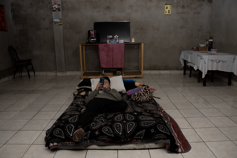 © Evelyn Corte Espinosa - Yosva resting in her bed after a hard day at work.