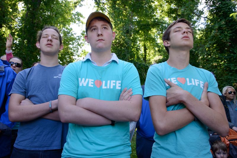 © Alice Proujansky - Anti-abortion protestors affiliated with Love Life Charlotte stand across the street from A Preferred Women's Health Center.