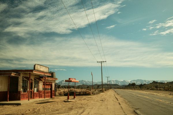 © Gem Redford - Palmdale, CaliforniaAbandoned roadside building and gas pump along desert highway.