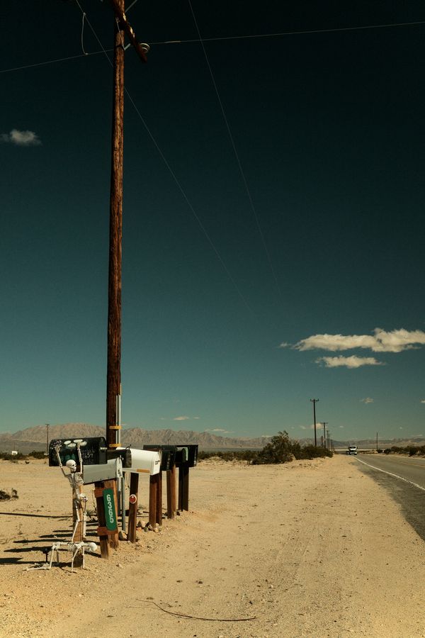 © Gem Redford - Mojave Desert, CaliforniaRow of vintage gas pumps beside roadside.