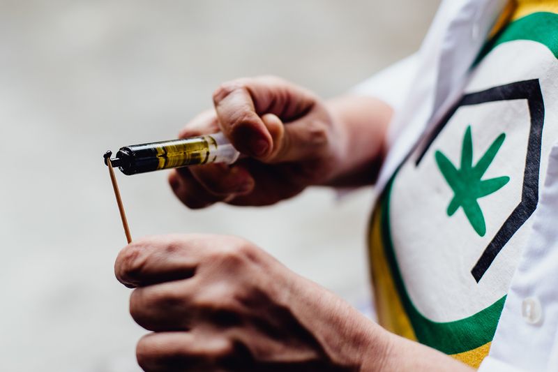 © Steef Fleur - São Paulo, Brazil. Medical patient takes her daily THC paste.