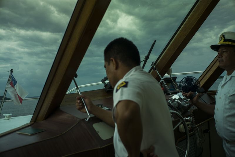 © Raphael Alves - Man sail a private boat in Negro River, Manaus, Amazonas, Brazil, on August, 27th, 2016.