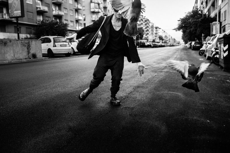 © Gianluca Abblasio - 2014 Rome - Italy . Play with pigeons at the dawn.