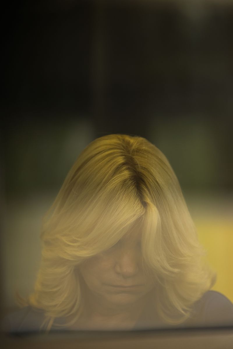 © Dariusz Jasak - Woman sitting in the parking booth