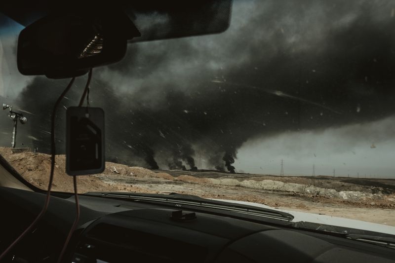 © Alexandra Howland - Oil wells burn near Qayarrah.