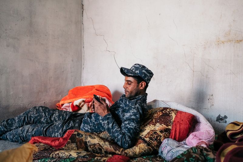© Alexandra Howland - A Federal Police solider takes a break from his post.