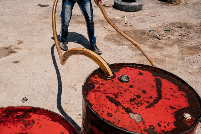© Alexandra Howland - Oil tanks are refilled in Karamles, Iraq.