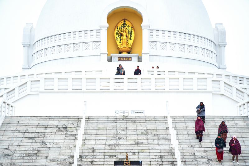 © tibhesh - Pilgrims descending from World Peace Pagoda.