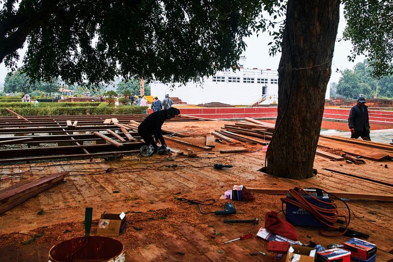 © tibhesh - A Carpenter working in front of Mayadevi Temple.