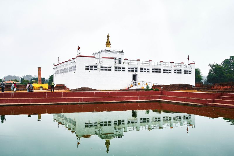 © tibhesh - Mayadevi Temple with Ashoka Piller, the exact birthplace of Lord Buddha.