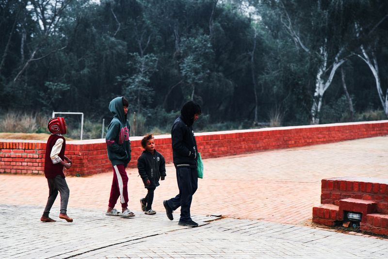 © tibhesh - Four underprivileged local children roaming around Lumbini.