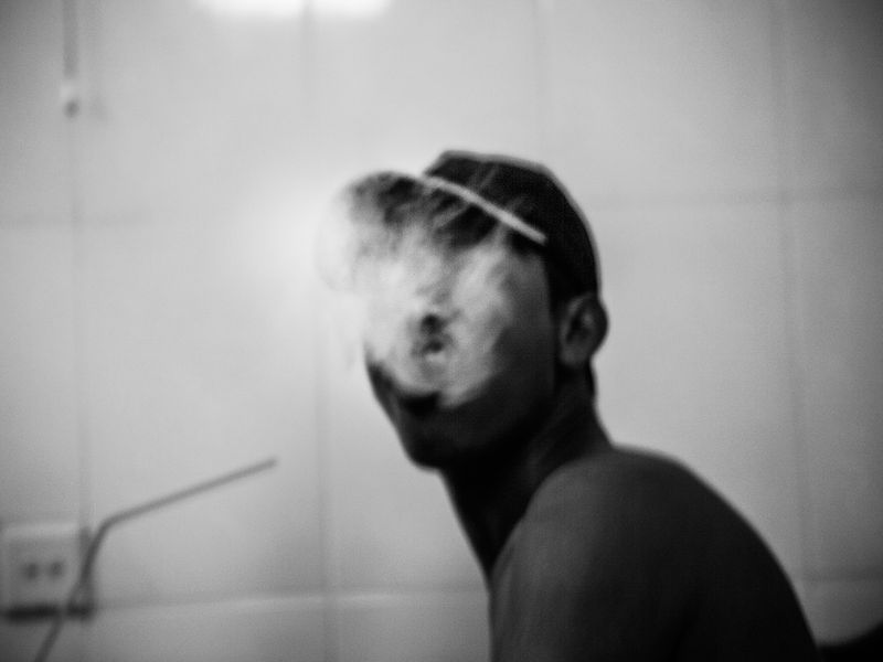 © Toni Arnau - “I don’t smoke everyday, if I smoke everyday I go crazy,” says Trian, 23. Phnom Penh, Cambodia 2017.