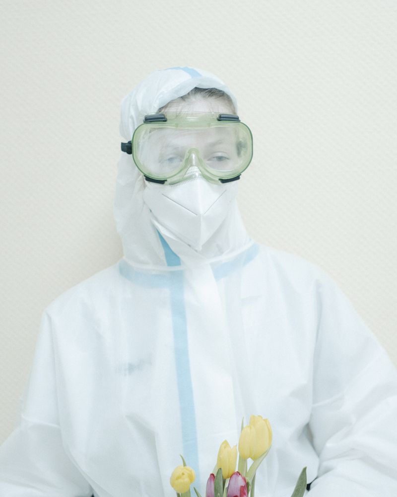 © Nanna Heitmann - Nurse with flowers for war veterans on 9th of May