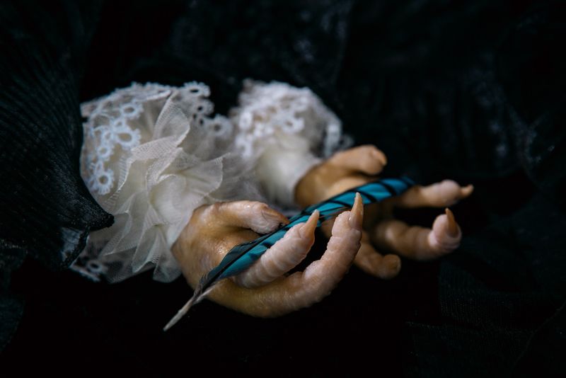 © Mari Saxon - Consecration (Chicken claws, like the hands of a fairy-tale creature, hold a blue feather from Maeterlinck’s Blue Bird.)
