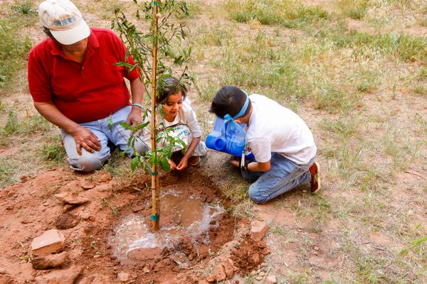 © Julien McRoberts - Planting ceremony - elders pass on tradition to the grandchildren. Navajo