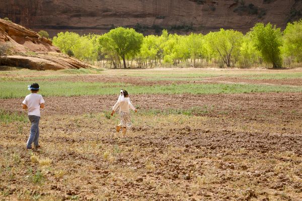 © Julien McRoberts - Planting ceremony - elders pass on tradition to the grandchildren. Navajo