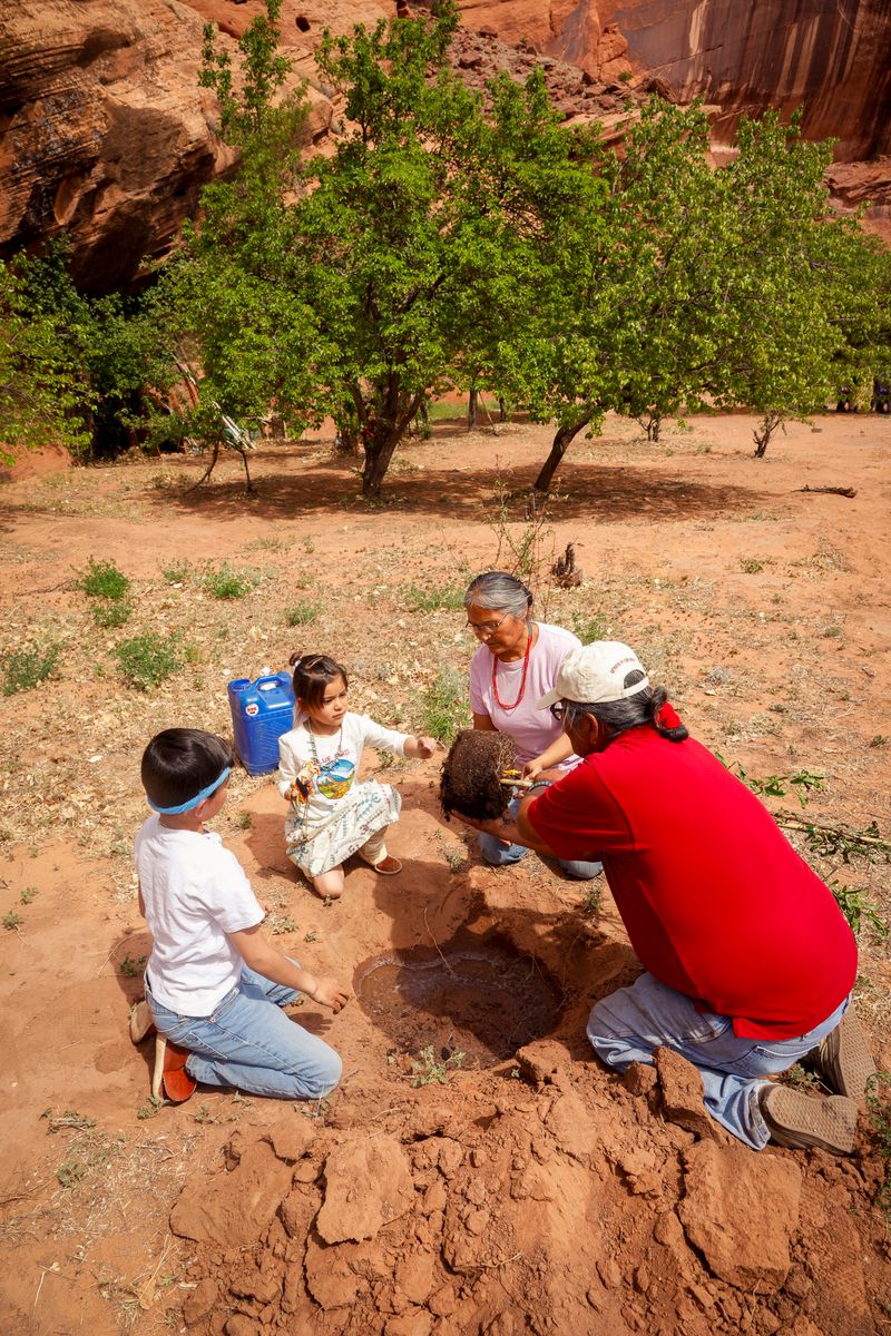 © Julien McRoberts - Planting ceremony - elders pass on tradition to the grandchildren. Navajo
