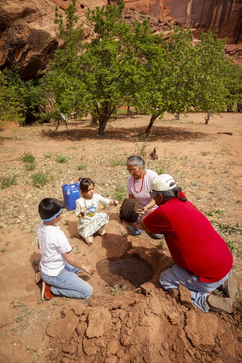 © Julien McRoberts - Planting ceremony - elders pass on tradition to the grandchildren. Navajo