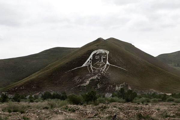 © Alvaro Laiz - Outskirts of Ulaanbataar. Genghis Khan image has been drawn over a hill with stones.