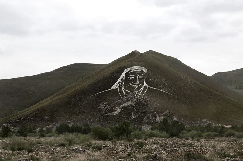 © Alvaro Laiz - Outskirts of Ulaanbataar. Genghis Khan image has been drawn over a hill with stones.