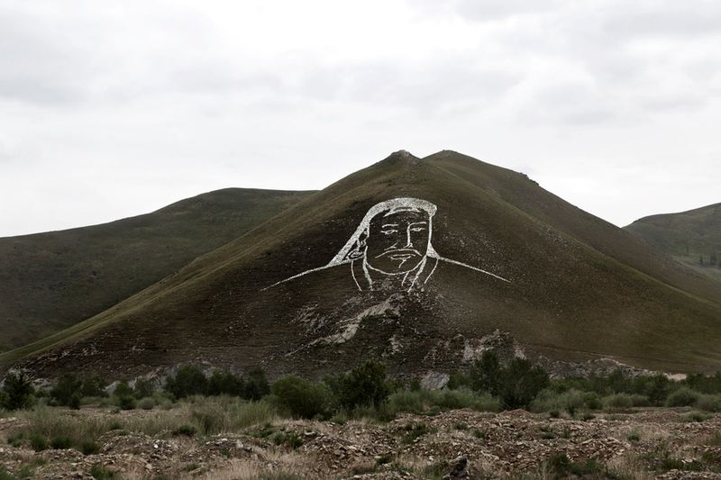 © Alvaro Laiz - Outskirts of Ulaanbataar. Genghis Khan image has been drawn over a hill with stones.