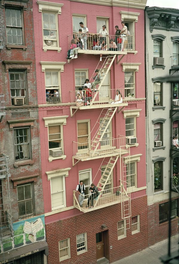 © Tria Giovan - Fire Escape Viewing on Stanton Street-1990. From the series Loisaida Street Work-1984 to 1990.