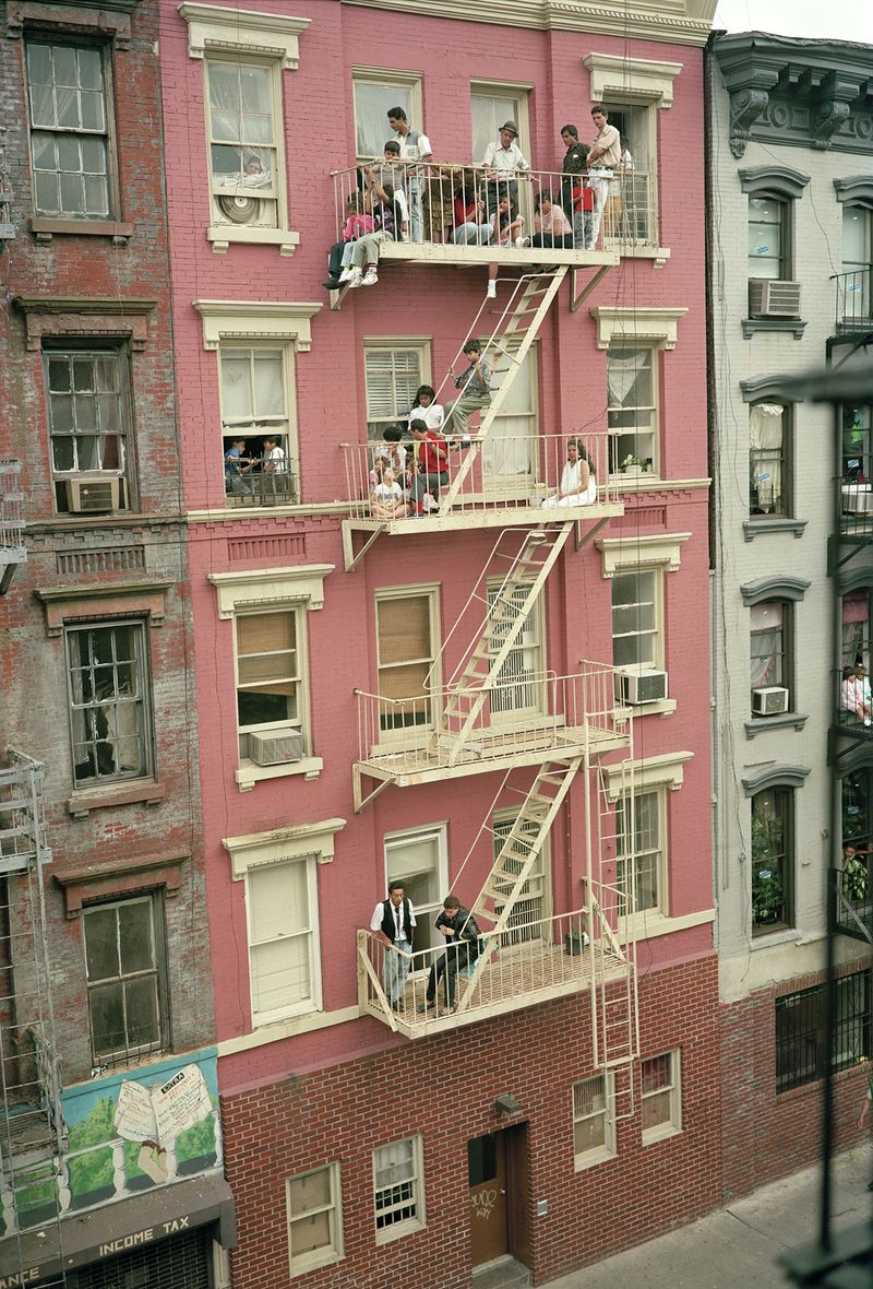 © Tria Giovan - Fire Escape Viewing on Stanton Street-1990. From the series Loisaida Street Work-1984 to 1990.