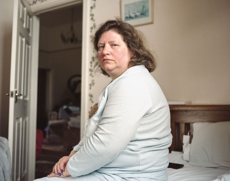 © Frankie Mills - Tanya Drobot pictured in bed at her sponsors home, Moorhaven, April, 2023.