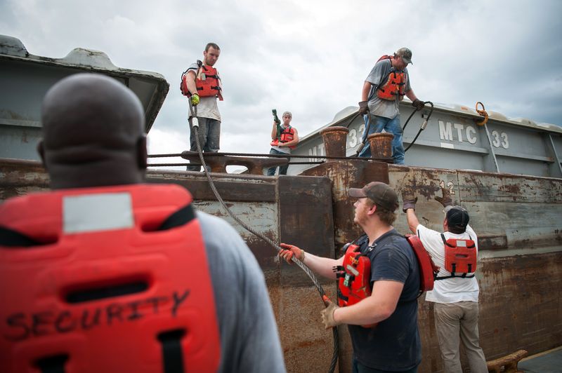© Rory Doyle - Crew Members organize a barge at the Port of Rosedale in Rosedale, Mississippi, USA.