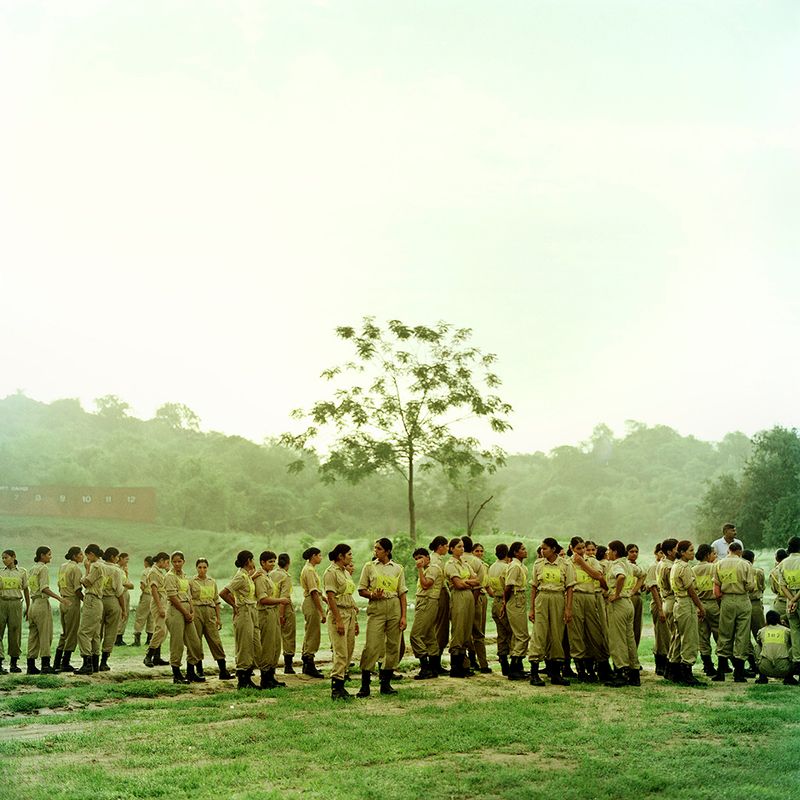© Poulomi Basu - PBASU_TCHL_018 Alpha coy of 118 women at dawn wait for their training to begin. Khatka Camp, Punjab, June 2009.
