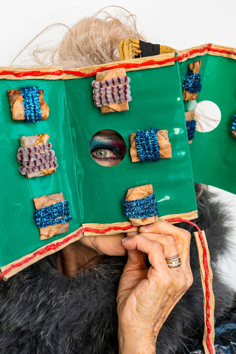 © Natalia L Rudychev - Debra Rapoport with her recycled fashion accessory embellished by used tea bags.