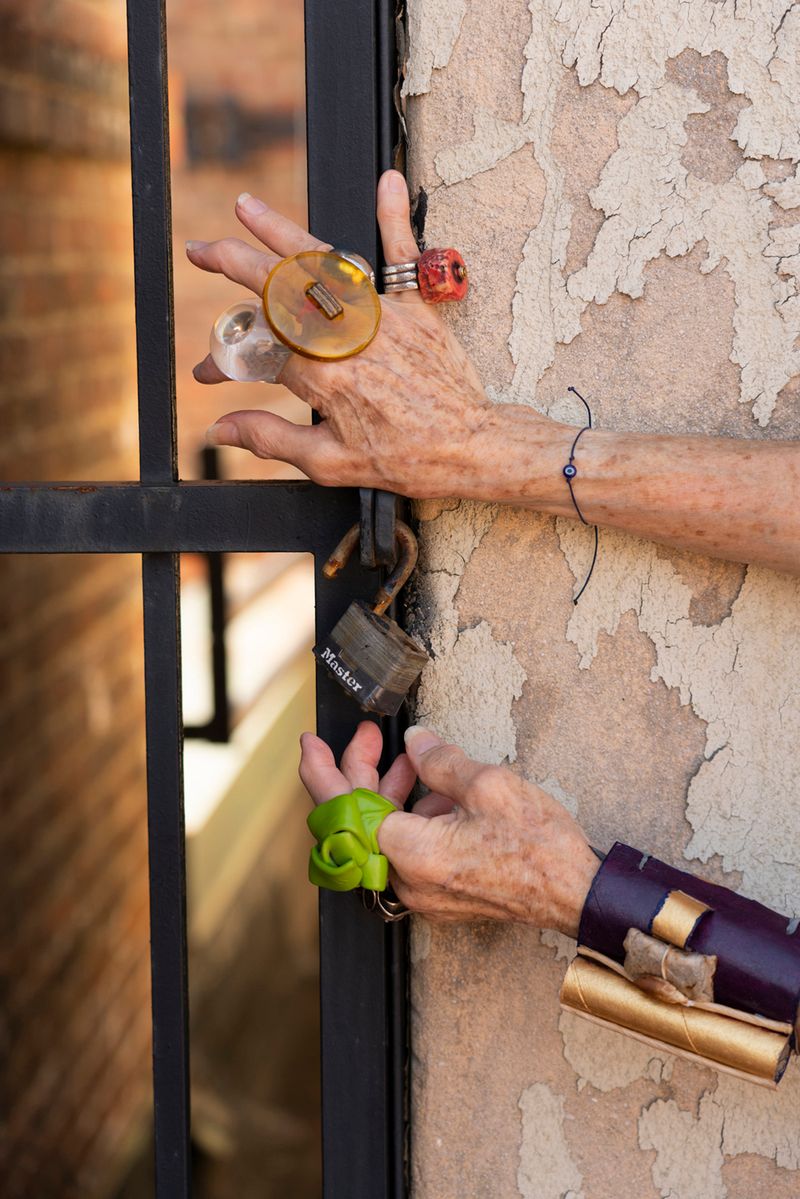 © Natalia L Rudychev - No Master Lock Can Hold the Creativity In. Artists hands featuring toilet paper roll bracelet.