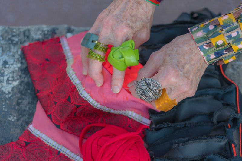 © Natalia L Rudychev - Artists hands. Turning left over pieces of fabric into high fashion gauntlets.