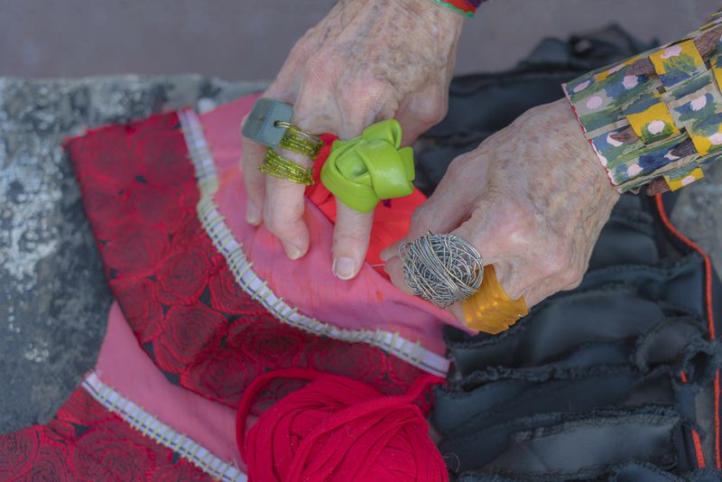 © Natalia L Rudychev - Artists hands. Turning left over pieces of fabric into high fashion gauntlets.