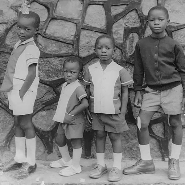 © Chrystel Mukeba - Portrait of my father and his brothers in front the wall of the  family home at Mbuji-Mayi