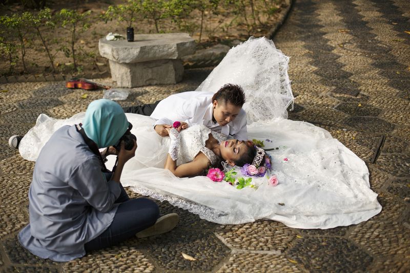 © Rebecca Sampson - Muslim, tomboy and beauty queen come together to document a mock wedding ceremony