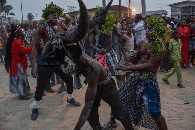 © Chukwuka Obu - 12. Horned deity being held tightly upclose