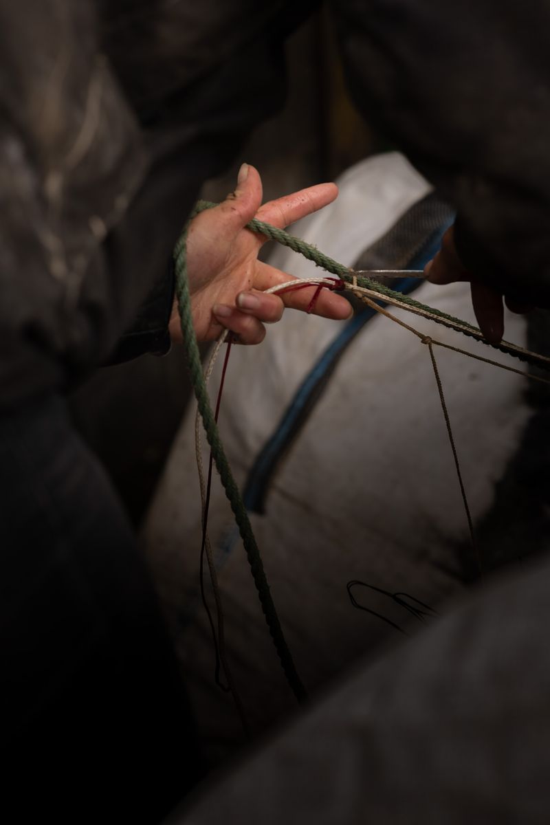 © Julie Bourges - Camille is repairing a fishing net
