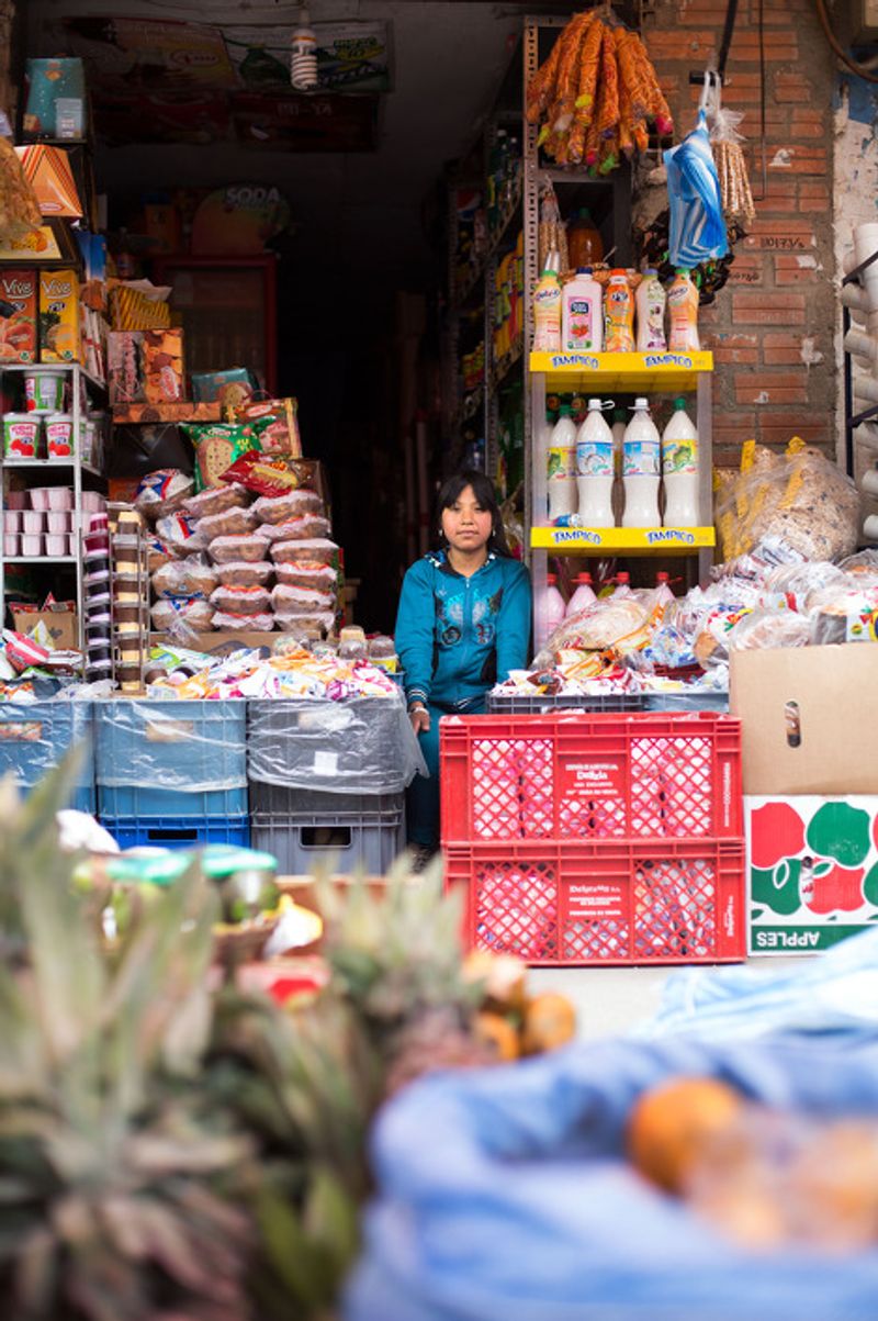 © Toby Binder - Deisi (12) is helping in the store of her mother every day after school. During holidays she is working there all day long.