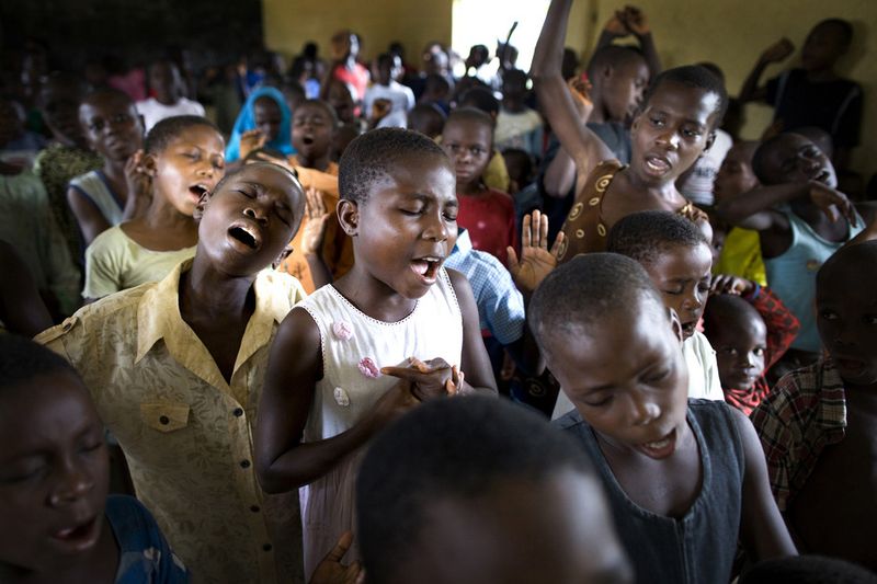 © Toby Binder - Children are singing during the Sunday service at the Centre of CRARN.
