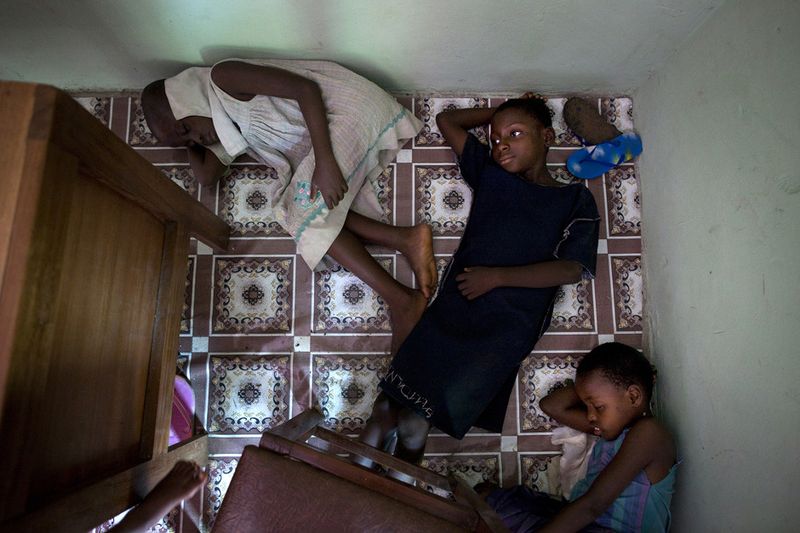 © Toby Binder - Children sleeping after class on the floor in the Centre of the Child’s Right And Rehabilitation Network.