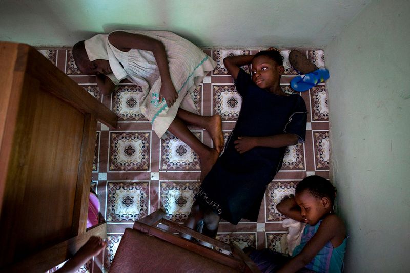 © Toby Binder - Children sleeping after class on the floor in the Centre of the Child’s Right And Rehabilitation Network.