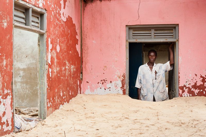 © Nyani Quarmyne - Numour Puplampo of Totope has been forced to abandon his home as it is has been buried by the sea.