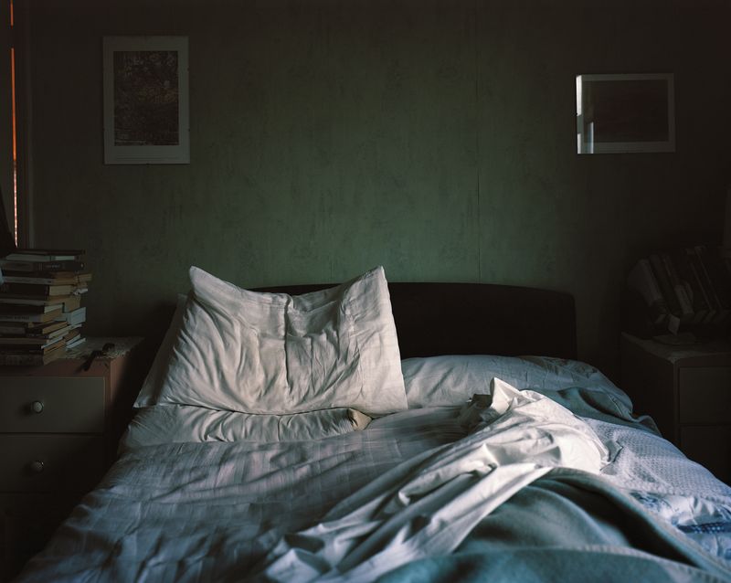 © Oliver Woods - My dad's side of the bed, as he had left it on his last morning. I photographed this very early on in the project.