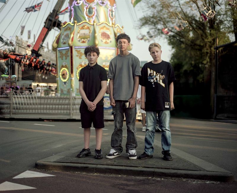© Nina Schollaardt - CJ (14), Rivano (14), and Ceel (14) at the fun fair in Tilburg, July 2024
