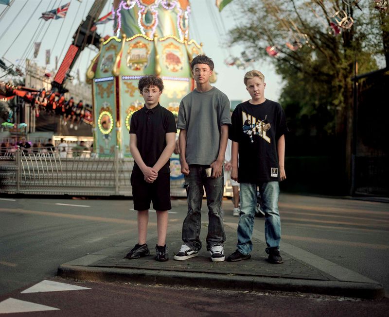 © Nina Schollaardt - CJ (14), Rivano (14), and Ceel (14) at the fun fair in Tilburg, July 2024